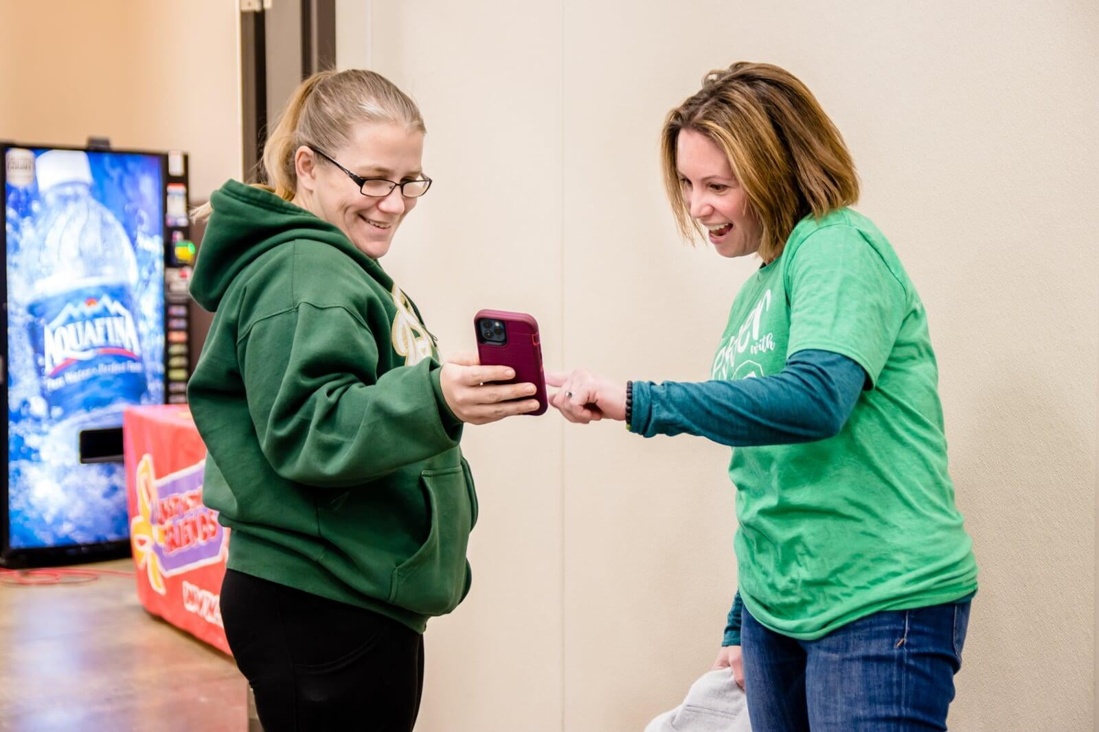 An associate helps a consignor connect on the FB app.