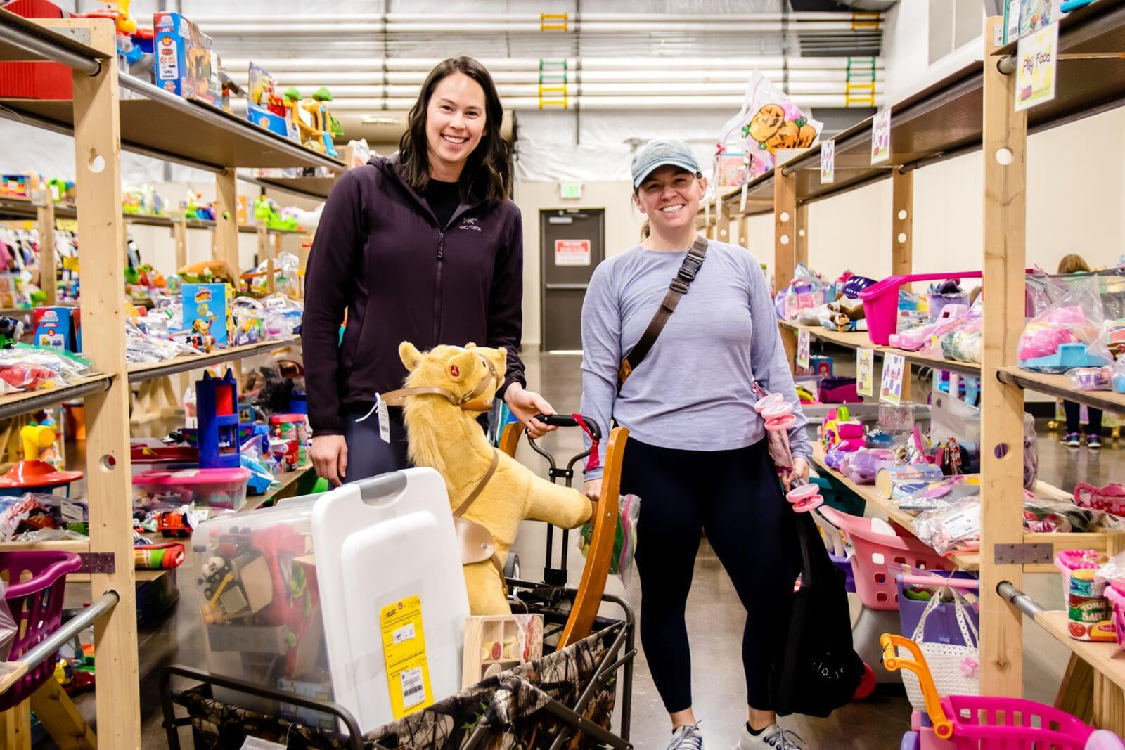 A masked Team Member with gloves helps out at a local JBF sale.